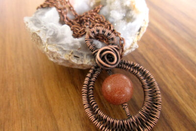 Circular Copper and Goldstone Pendant