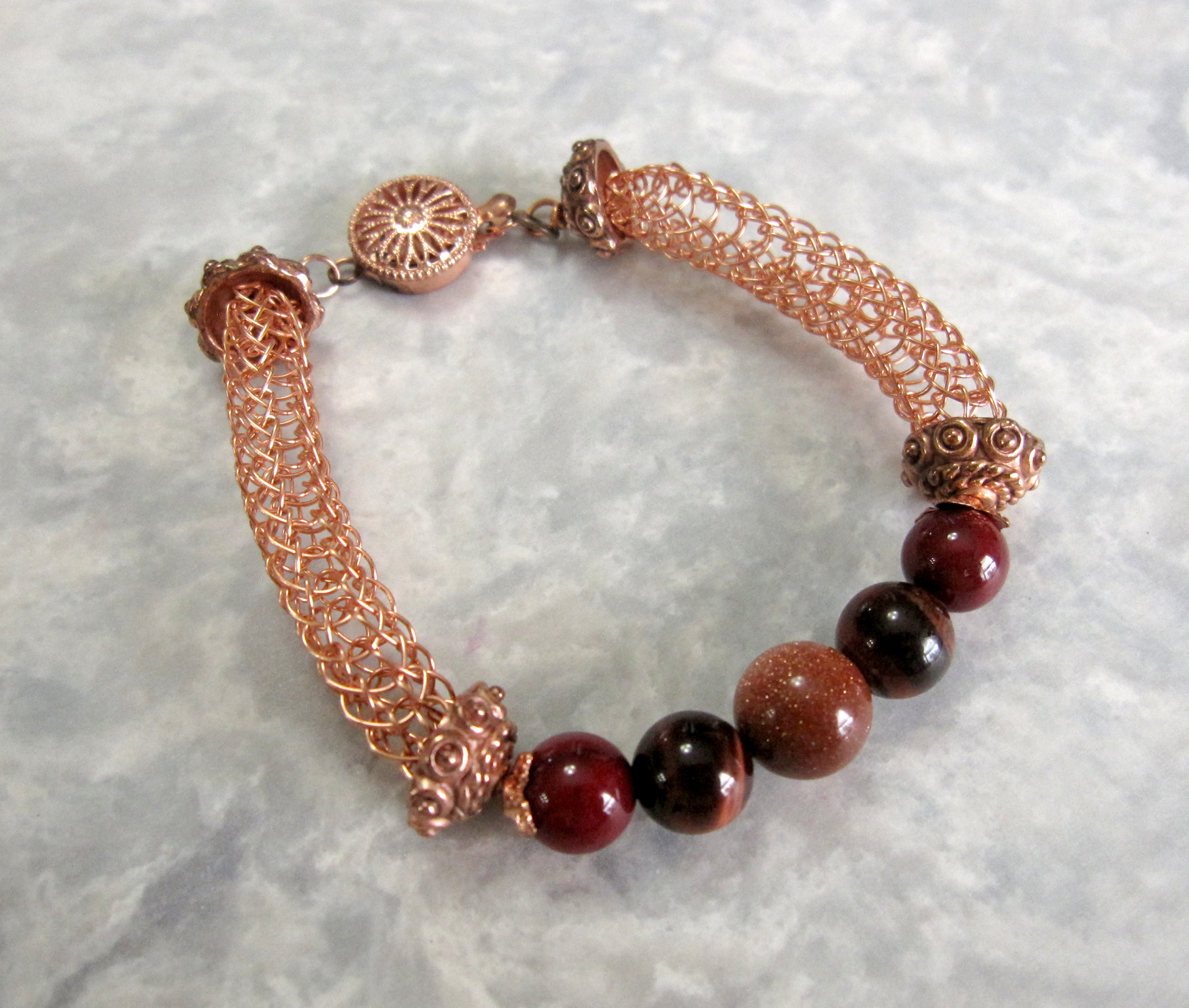 Tarnish Resistant Copper with Red Agate, Red Tiger's Eye and Goldstone Beads, Finished with a Round Filigree Catch