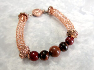 Tarnish Resistant Copper with Red Agate, Red Tiger's Eye and Goldstone Beads, Finished with a Round Filigree Catch