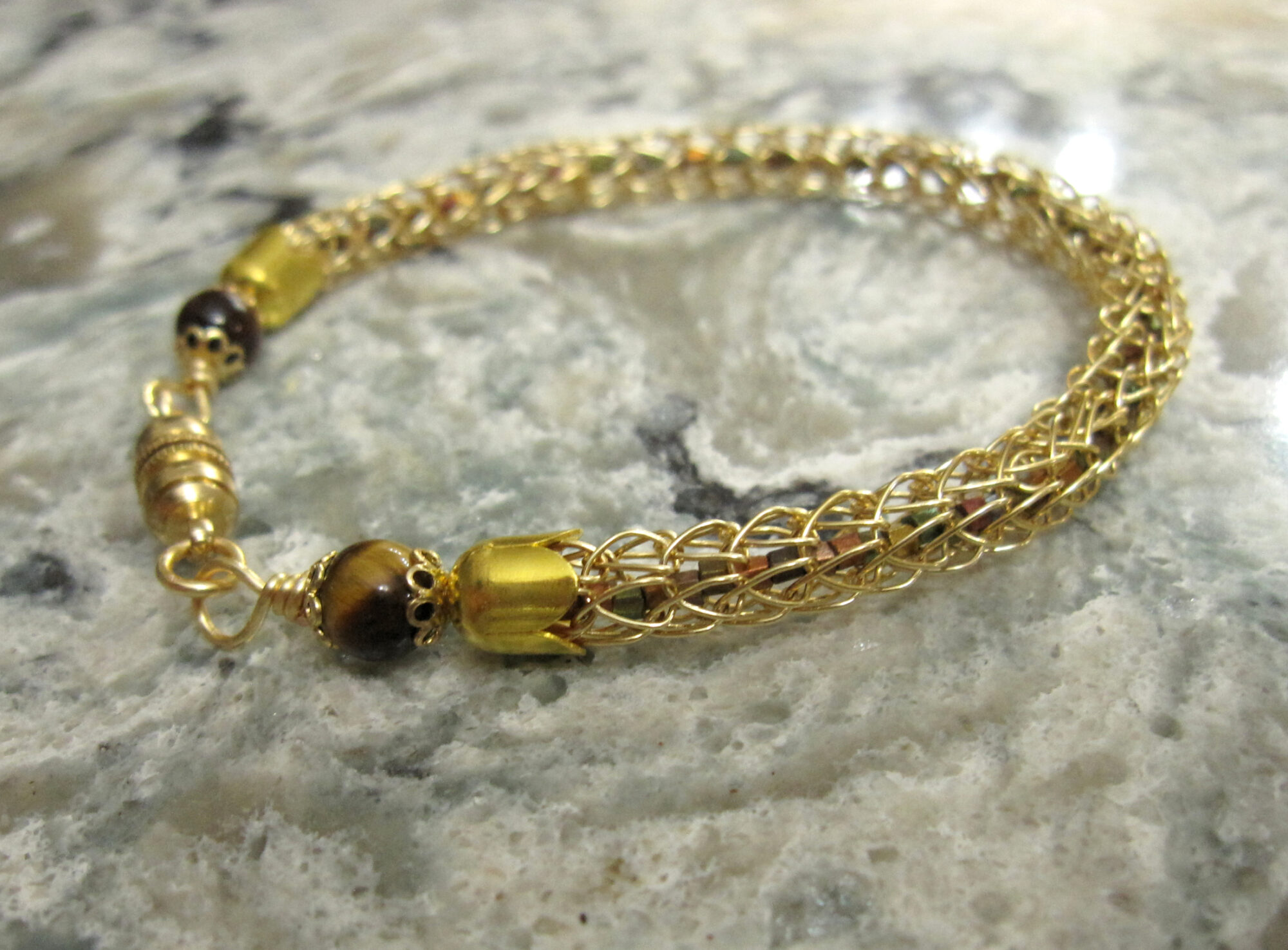 Gold Viking Knit Bracelet Filled With Metallic Seed Beads and Finished with Tiger's Eye Beads and a Magnetic Catch