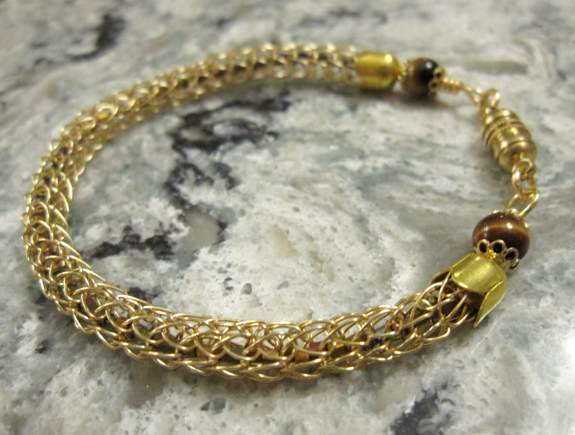 Gold Viking Knit Bracelet Filled With Metallic Seed Beads and Finished with Tiger's Eye Beads and a Magnetic Catch