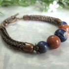 Lapis Lazuli, Sodalite, and Goldstone Beads set in a Double Viking Knit bracelet
